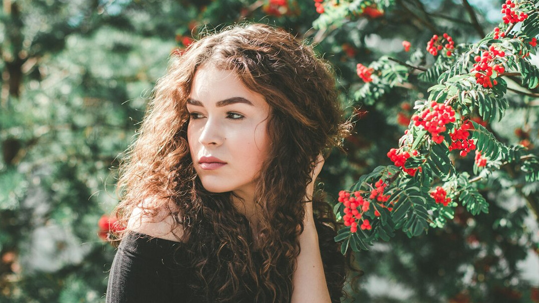 Studio portrait of a young Croatian woman with curly hair