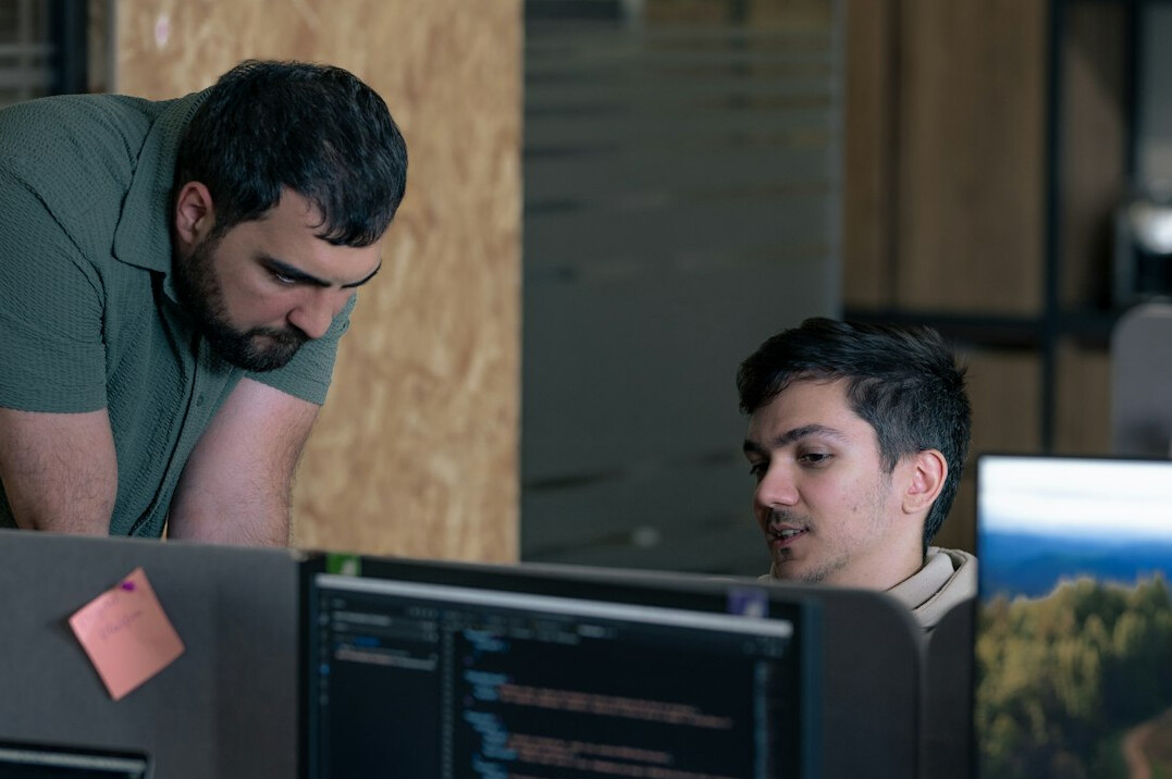 corporate team collaborating on code